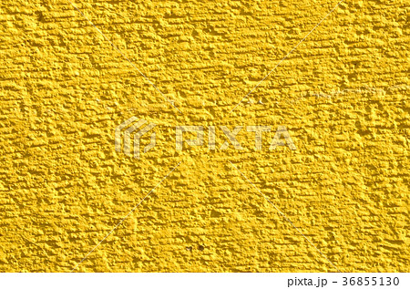 黄色い壁 背景の写真素材