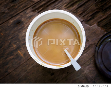 Cup of coffee on wooden table, top view Cup of coffee on wooden table, top view 36859274