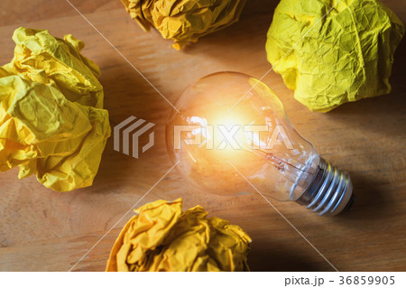 concept crumpled paper around light bulb concept crumpled paper around light bulb 36859905