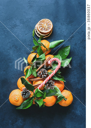 Christmas tree with tangerines, candy cane, spices 36860037