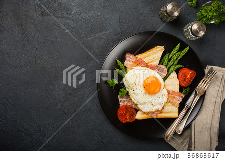 Fried egg with bread toast and asparagus Fried egg with bread toast and asparagus 36863617