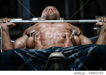 Brutal strong bodybuilder athletic men pumping up muscles with d Brutal strong bodybuilder athletic men pumping up muscles with d 36863703