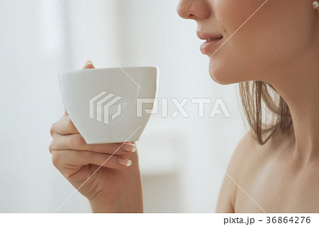 Coffee. Beautiful Girl Drinking Tea or Coffee. Cup 36864276