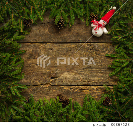Christmas tree branches with snowman Christmas tree branches with snowman 36867528