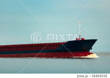 Blue cargo ship underway 36869036