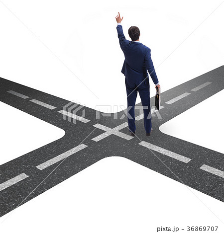 Young businessman at crossroads in uncertainty 36869707
