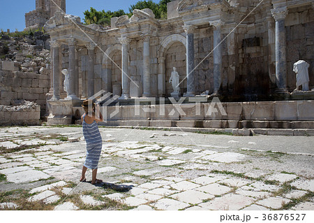 woman traveller photographing agora at ancient city of Sagalassp woman traveller photographing agora at ancient city of Sagalassp 36876527