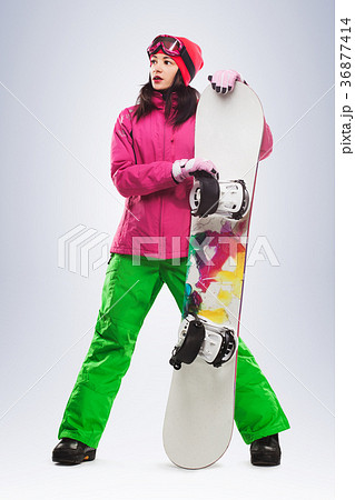 Girl with snowboard in studio on isolated Girl with snowboard in studio on isolated 36877414