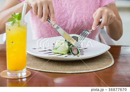 Woman eat crunchy tuna spring roll  36877670