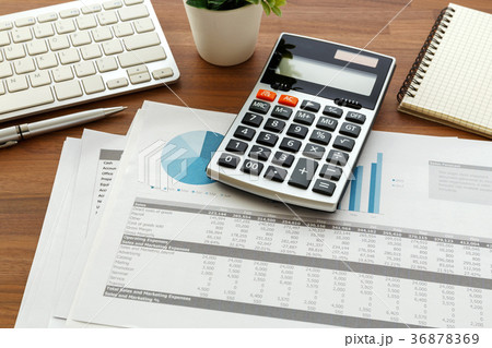 Financial accounting on wooden table 36878369
