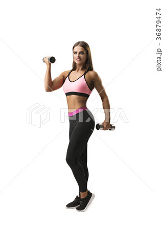 Sexy slim brunette with dumbells isolated shot 36879474