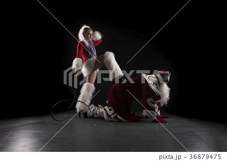 Snow Maiden with whip and Santa on his knees shot 36879475