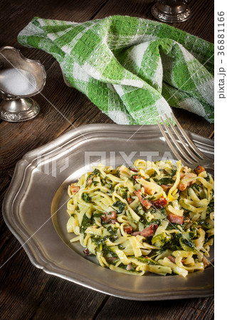 Spaghetti with spinach and bacon. 36881166