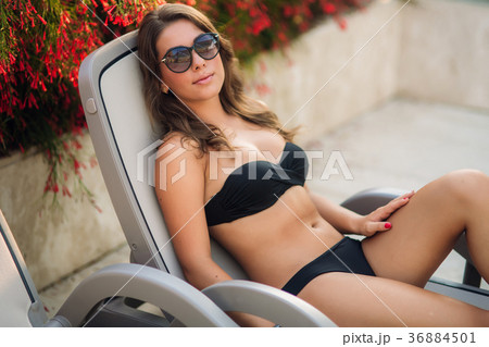 Beautiful girl lies on the lounger. summer sunny 36884501