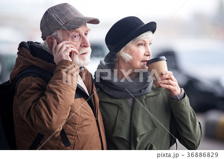 Pensive aged couple is resting outdoors 36886829