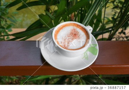 close up coffee cappuccino on wooden balcony close up coffee cappuccino on wooden balcony 36887157