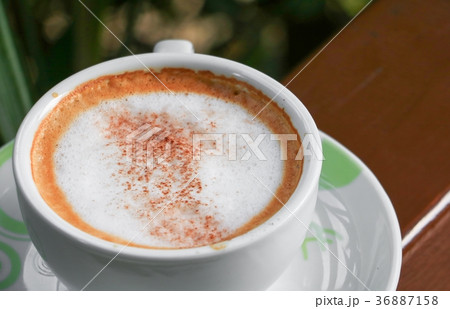 close up coffee cappuccino on wooden balcony 36887158
