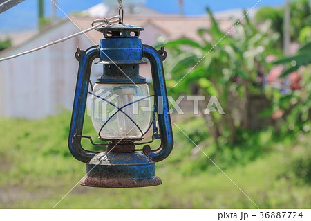 Old blue rusty lantern in the garden Old blue rusty lantern in the garden 36887724