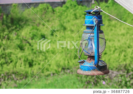 Old blue rusty lantern in the garden 36887726