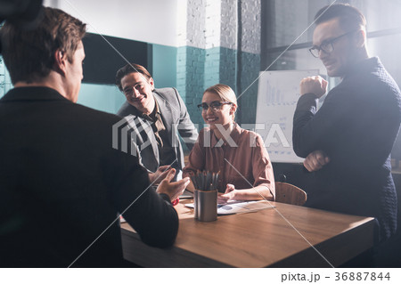Startup team working together at table 36887844