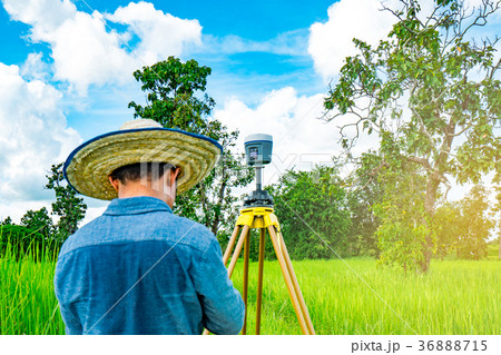 GPS surveying instrument and Asian smart engineer GPS surveying instrument and Asian smart engineer 36888715