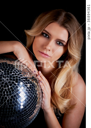 The blonde laying in the style of Abba holds a The blonde laying in the style of Abba holds a 36894361