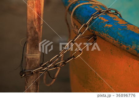 Metal Chain Ties Round Fishing Boat to Pole Metal Chain Ties Round Fishing Boat to Pole 36896776