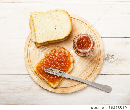 Jar of peach jam with bread Jar of peach jam with bread 36898310