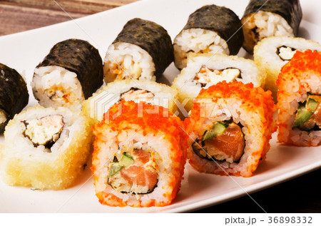 Different sushi roll on a plate 36898332