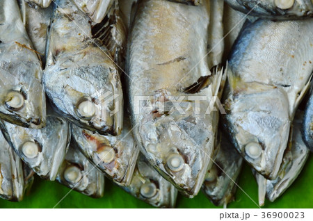boiled mackerel on fresh banana leaf in market 36900023