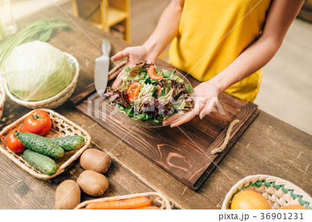 Female person cooking salad, healthy organic food 36901231