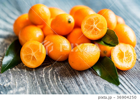 Kumquat or cumquat on wooden table 36904250
