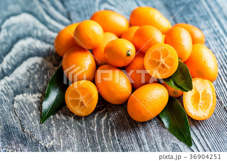 Kumquat or cumquat on wooden table 36904251