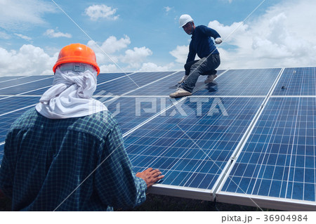 engineer team working on replacement solar panel 36904984