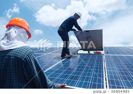 engineer team working on replacement solar panel engineer team working on replacement solar panel 36904985