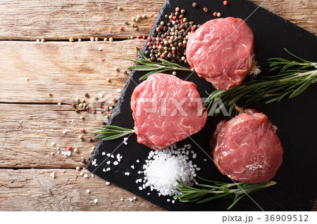 fresh raw beef fillet mignon on old wooden 36909512