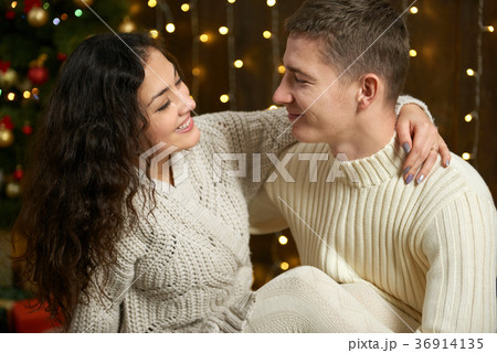 young couple together in christmas lights 36914135