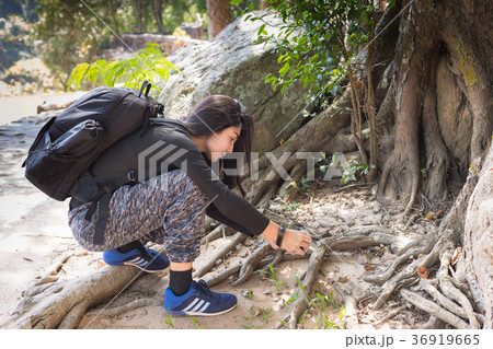 Asian woman backpack taking a photo 36919665