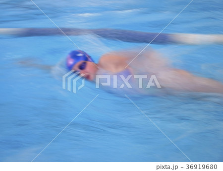Swimmer in cap breathing  bokeh effect 36919680