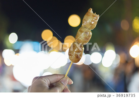Thai style grilled pork sausage with bamboo sticks 36919735