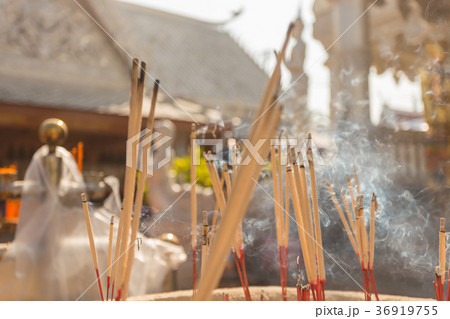 Incense sticks burning with white smoke Incense sticks burning with white smoke 36919755