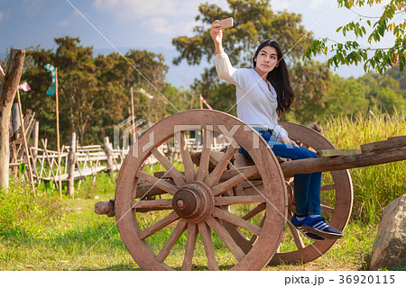 Asian woman in the green rice fields meadow 36920115