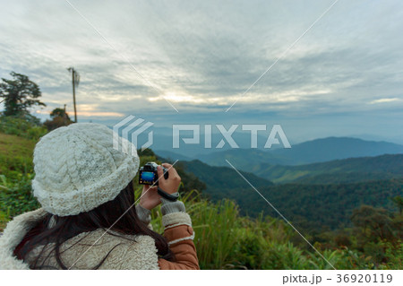 Photographer taking photo of landscape Photographer taking photo of landscape 36920119