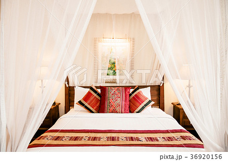 Colonial style wooden four poster bed with curtain 36920156
