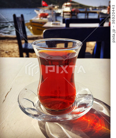 turkish tea on wooden table next to sea 36920443