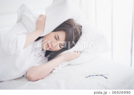 beautiful Asian women sick with sleep on bed 36926990