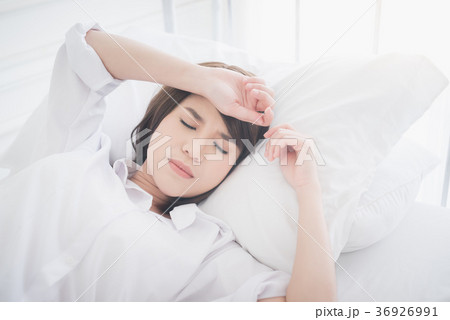 beautiful Asian women sick with sleep on bed beautiful Asian women sick with sleep on bed 36926991