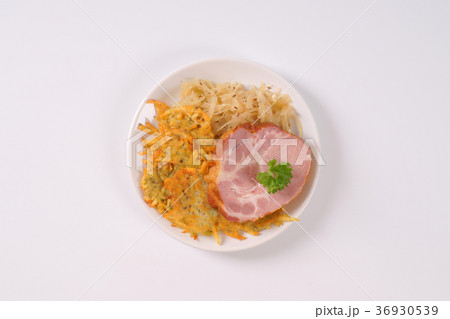 smoked pork with potato pancakes and sauerkraut 36930539