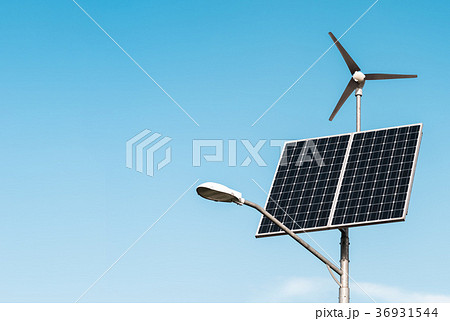 Solar panel, wind turbine under blue sky 36931544