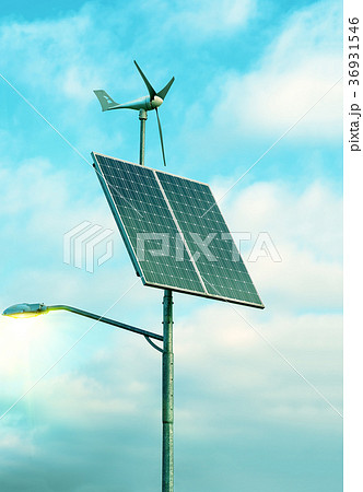 Solar panel, wind turbine under cloudy blue sky Solar panel, wind turbine under cloudy blue sky 36931546